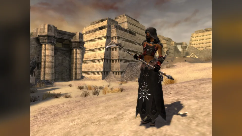 A hooded necromancer with a staff stands before stepped stone buildings in the desert.