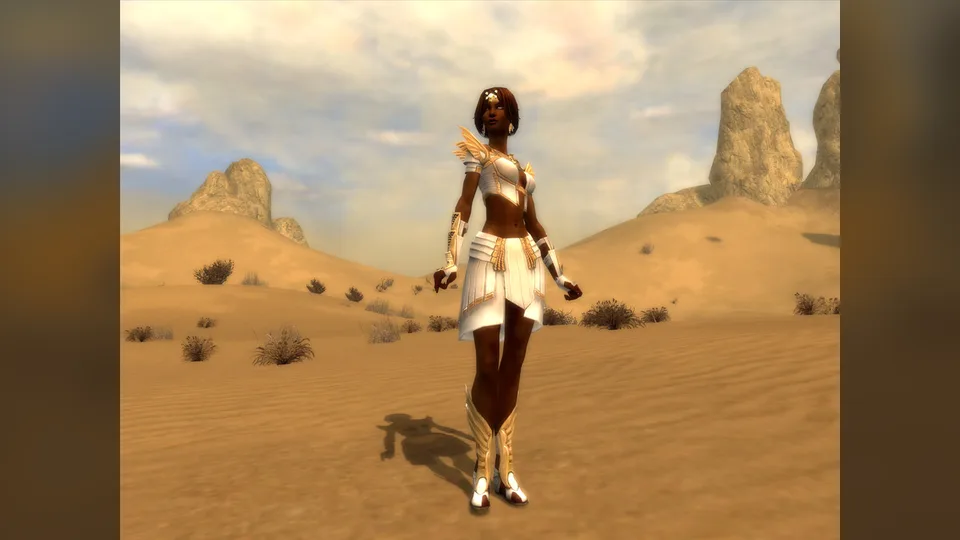 A female character in white and gold armor stands on desert dunes.