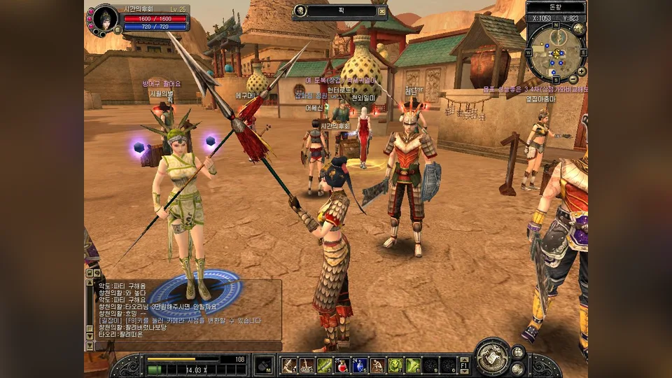 A Silkroad Online character in full armor stands in a desert town with the game HUD around the screen.