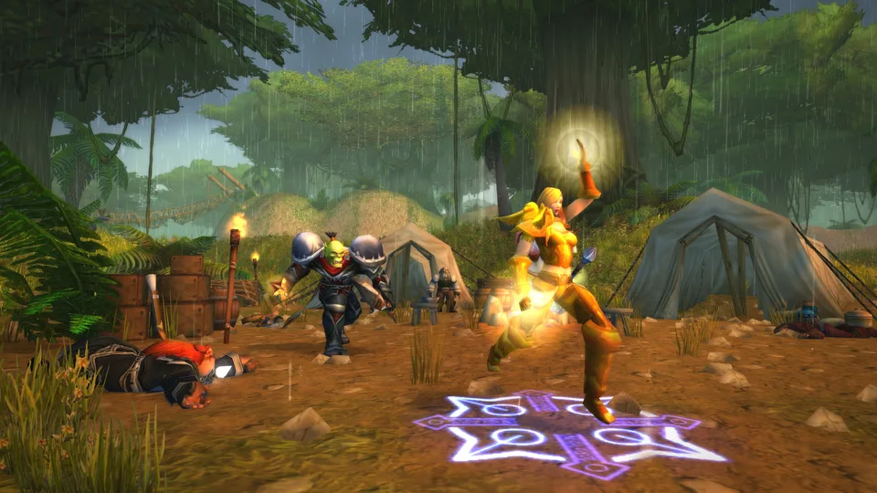 Player characters fighting and casting beside a jungle camp in the rainy Stranglethorn Vale.
